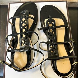 Coach black patent sandals.